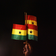 A Ghana fan holds up Ghanaian flags during an international soccer game.
Ryan Pierse/Getty Images